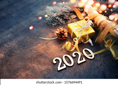 happy new year 2020 background with champagne in dark color with bokeh - Shutterstock ID 1576694491
