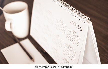 Happy new year 2020 concept: Close up calendar on desktop 
