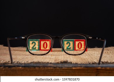 Happy New Year 2020. 2020 With Glasses On Black Background