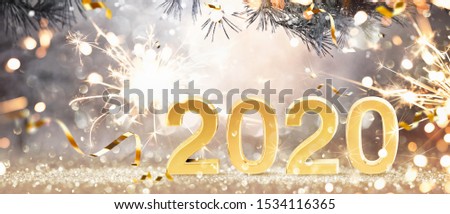 Happy New Year 2020. Golden Background with Sparklers and Confetti Stock photo © 