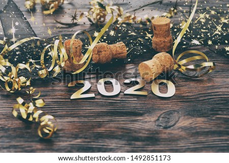 Happy New Year 2020. Symbol from number 2020 on wooden background