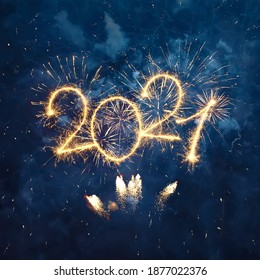 Happy New Year 2021. Beautiful creative Square holiday web banner or Greeting card with Golden firework and sparkling number 2021 on night blue sky background. - Shutterstock ID 1877022376