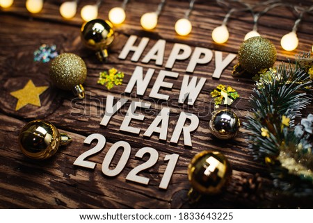 Happy New Year 2021. Symbol from number 2021 on wooden background