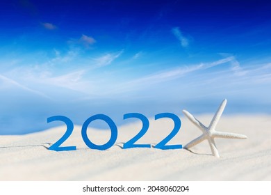 Happy New Year 2022. Abstract cean beach background photo of coming New Year 2022 and leaving year of 2021