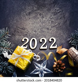 happy new year 2022  background new year holidays card with bright lights,gifts and bottle of сhampagne - Shutterstock ID 2018404820