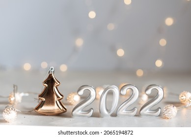 happy new year 2022 background new year holidays card with bright lights,gifts and bottle of hampagne - Shutterstock ID 2065194872