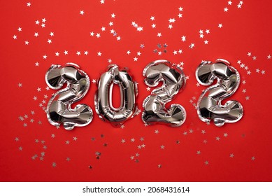 happy new year 2022 background new year holidays card with bright lights,gifts and bottle of hampagne - Shutterstock ID 2068431614