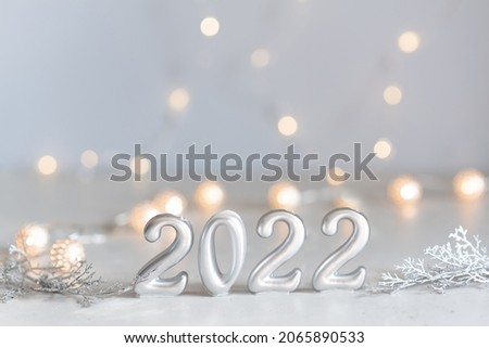 happy new year 2022 background new year holidays card with bright lights,gifts and bottle of hampagne