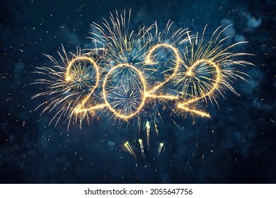 Happy New Year 2022. Beautiful creative holiday web banner or flyer with Golden firework and sparkling number 2022 on night blue sky background. - Shutterstock ID 2055647756