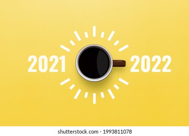 Happy new year 2022. Cup of coffee change 2021 to 2022 on yellow background. Start concept - Shutterstock ID 1993811078
