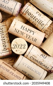 Happy New Year 2022 greeting card with wine corks. No visible trademarks