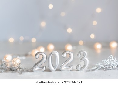 happy new year 2023 background new year holidays card with bright lights,gifts and bottle of hampagne - Shutterstock ID 2208244471