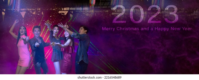 Happy New Year 2023 Celebration Concept, Traveler People Holding Glasses Of Wine Together With Enjoying, Dancing At Colorful Night Party Club.
