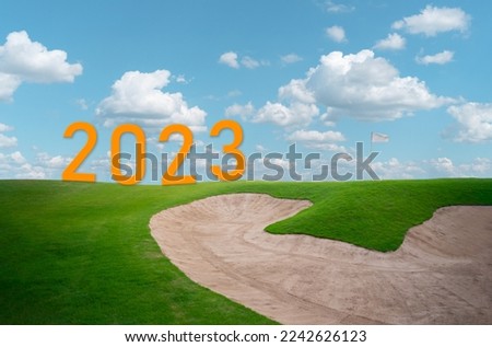 Happy new year 2023,2023 symbolizes the start of the new year. The letter start new year 2023 on the golf course field in the countryside clouds environment ecology or greenery wallpaper concept.