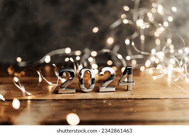 happy new year 2024 background new year holidays card with bright lights,gifts and bottle of hampagne - Shutterstock ID 2342861463