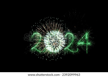 Happy New Year 2024. Beautiful New year firework banner. Overlay background. Colorful creative holiday Wallpaper or poster with firework and green sparkling text 2024. Sparks, fireworks on a holiday