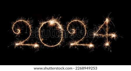 Happy New Year 2024. Burning sparkling text 2024 isolated on black background. Beautiful glowing design element for greeting card and holiday flyer. Text 2024 written with sparklers for holiday design