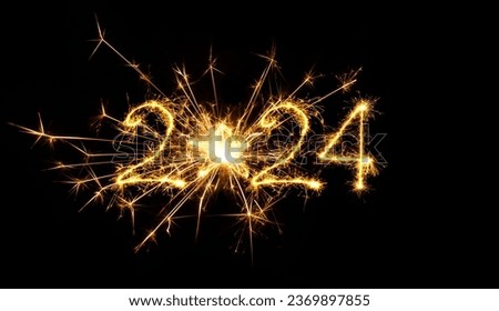 Happy New Year 2024. Sparkling burning numbers Year 2024 with star on black background. Beautiful Glowing golden overlay object for design holiday greeting card, billboard and Web banner
