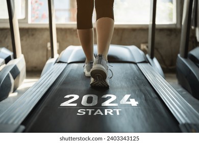 Happy new year 2024,2024 symbolizes the start of the new year. Close up of feet, sportswoman runner running on treadmill in fitness club. Cardio workout. Healthy lifestyle, guy training in gym.