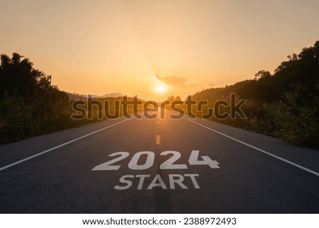Happy new year 2024,2024 symbolizes the start of the new year. The letter start new year 2024 on the road in the nature route roadway sunset tree environment ecology or greenery wallpaper concept.
