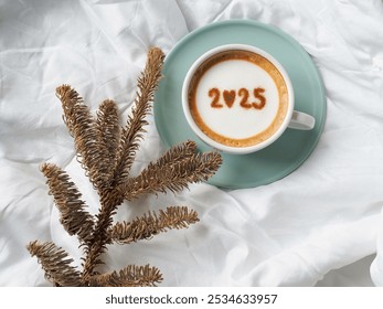 Happy New Year 2025 celebrated coffee cups with number 2025 over frothy surface flat lay on white bedsheet background with dried pine branches. Holidays food art theme. (top view, space for text) - Powered by Shutterstock