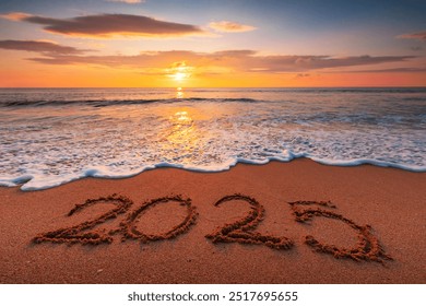 Happy New Year 2025, lettering on the beach sand. Written text on the sandy ocean shore at sunrise - Powered by Shutterstock