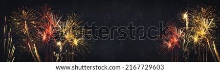 HAPPY NEW YEAR - Celebration New Year's Eve, Silvester 2023 holiday background panorama greeting card - Golden red firework fireworks pyrotechnics on dark night sky