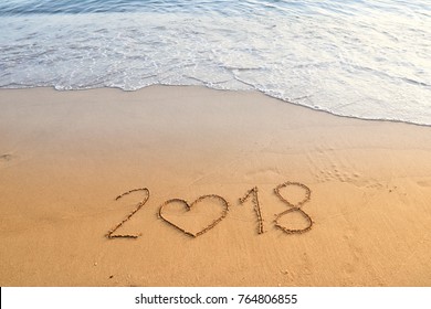 happy new year concept, 2018 written in the sand on a beach. - Powered by Shutterstock