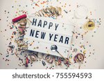 Happy New year displayed on a vintage lightbox with decoration for New Year