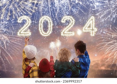 Happy new year. Family watching fireworks. Parents and kids celebrate new 2024 year. Winter holiday party. Outdoor fun. Children, mother and father with sparkler watch firework show. - Powered by Shutterstock