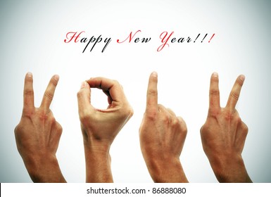 happy new year with hands forming number 2012
