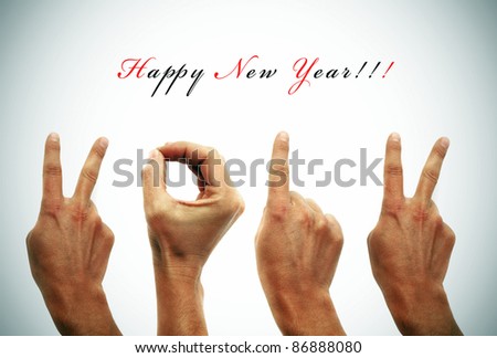 happy new year with hands forming number 2012