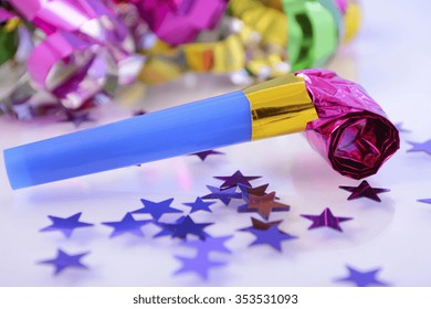 Happy New Year Party Decorations With Stars And Noise Maker, Closeup. 