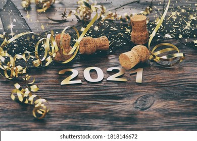 Happy New Year. Symbol from number 2021 on wooden background