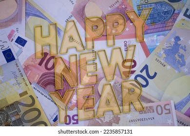 Happy New Year word with money. Paper currency background with different banknotes. - Shutterstock ID 2235857131