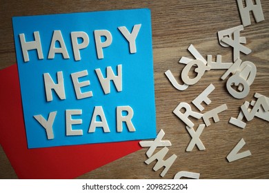 Happy new year written on blue paper