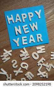 Happy new year written with wooden letters                             