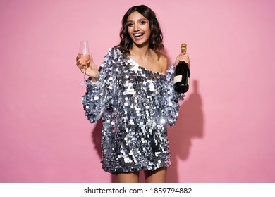 Happy New Year To You. One Young And Beautiful Woman In Sparkle Dress Dancing With Glass Of Champagne And Smiling