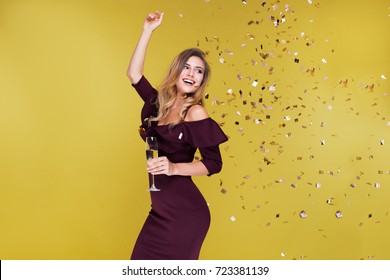 Happy New Year To You. One Young And Beautiful Woman Dancing With Glass Of Champagne And Smiling. Girl Is Happy About The New Year