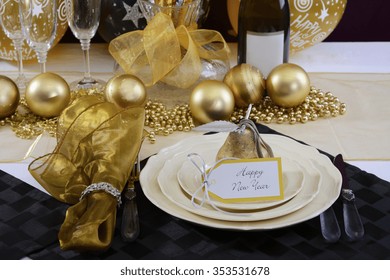 Happy New Years Eve Elegant Dinner Table Setting With Black And Gold Decorations, Balloons And Stylish Centerpiece, Close Up. 