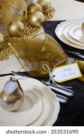 Happy New Years Eve Elegant Dinner Table Setting With Black And Gold Decorations, Balloons And Stylish Centerpiece, Close Up. 