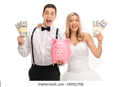 Happy Newlywed Couple With A Piggybank And Money Bundles Isolated On White Background