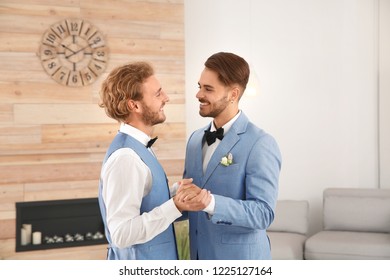 Happy Newlywed Gay Couple Dancing At Home