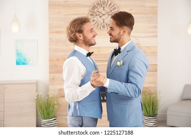 Happy Newlywed Gay Couple Dancing At Home