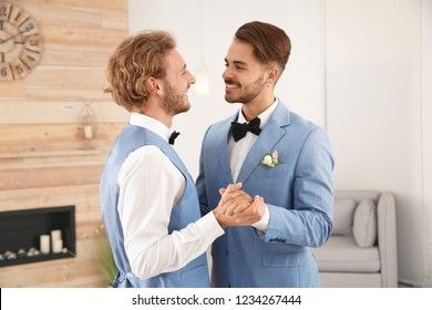 Happy Newlywed Gay Couple Dancing At Home