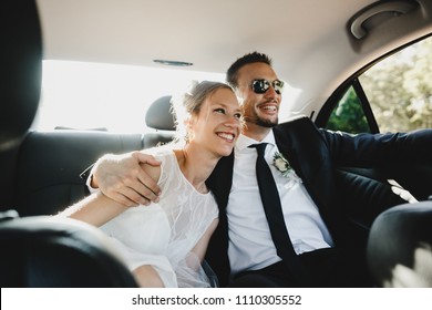 Happy Newlyweds Ride In The Car