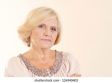 happy nice old woman on a beige background