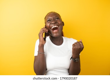 A Happy Nigerian Lady In Africa Making A Phonecall