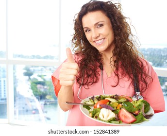 Happy Nurse Holding Salad Giving The Thumbs Up