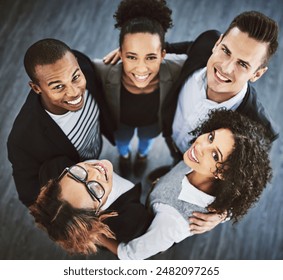 Happy, office and above portrait of business people for teamwork, collaboration and solidarity in workplace. Company, diversity and top view of men and women hug for support, community and coworking - Powered by Shutterstock